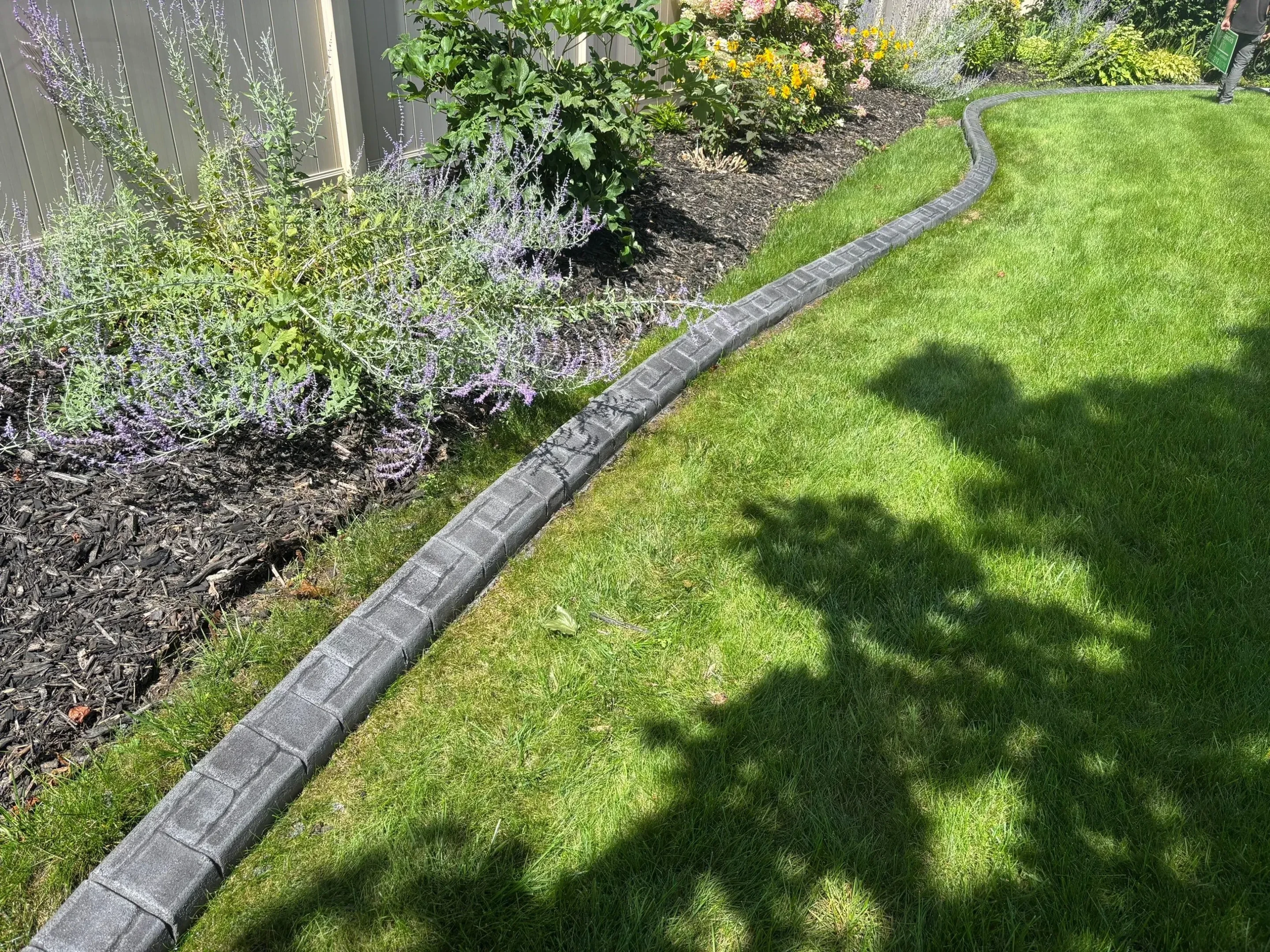 Professional landscape curbing tools and equipment on a Indiana residential property Professional landscape curbing tools and equipment on a Indiana residential property