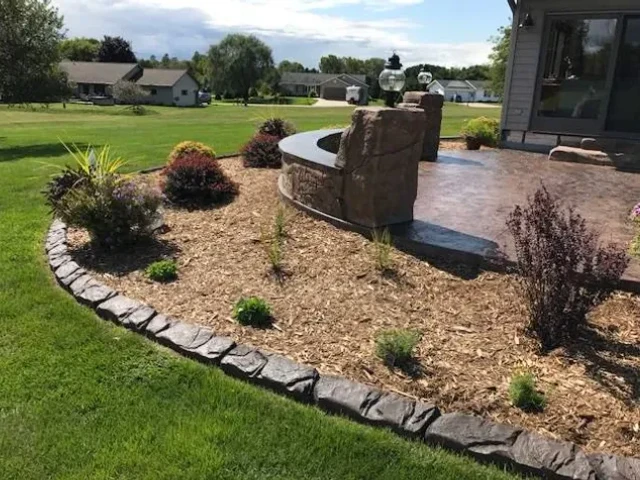 Straight curbing along driveway with landscaping
